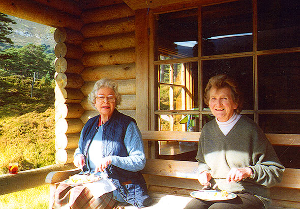 Enjoying lunch at Her Majesty’s log cabin with Lady Margaret Rhodes – a gin and Dubonnet perched on the side